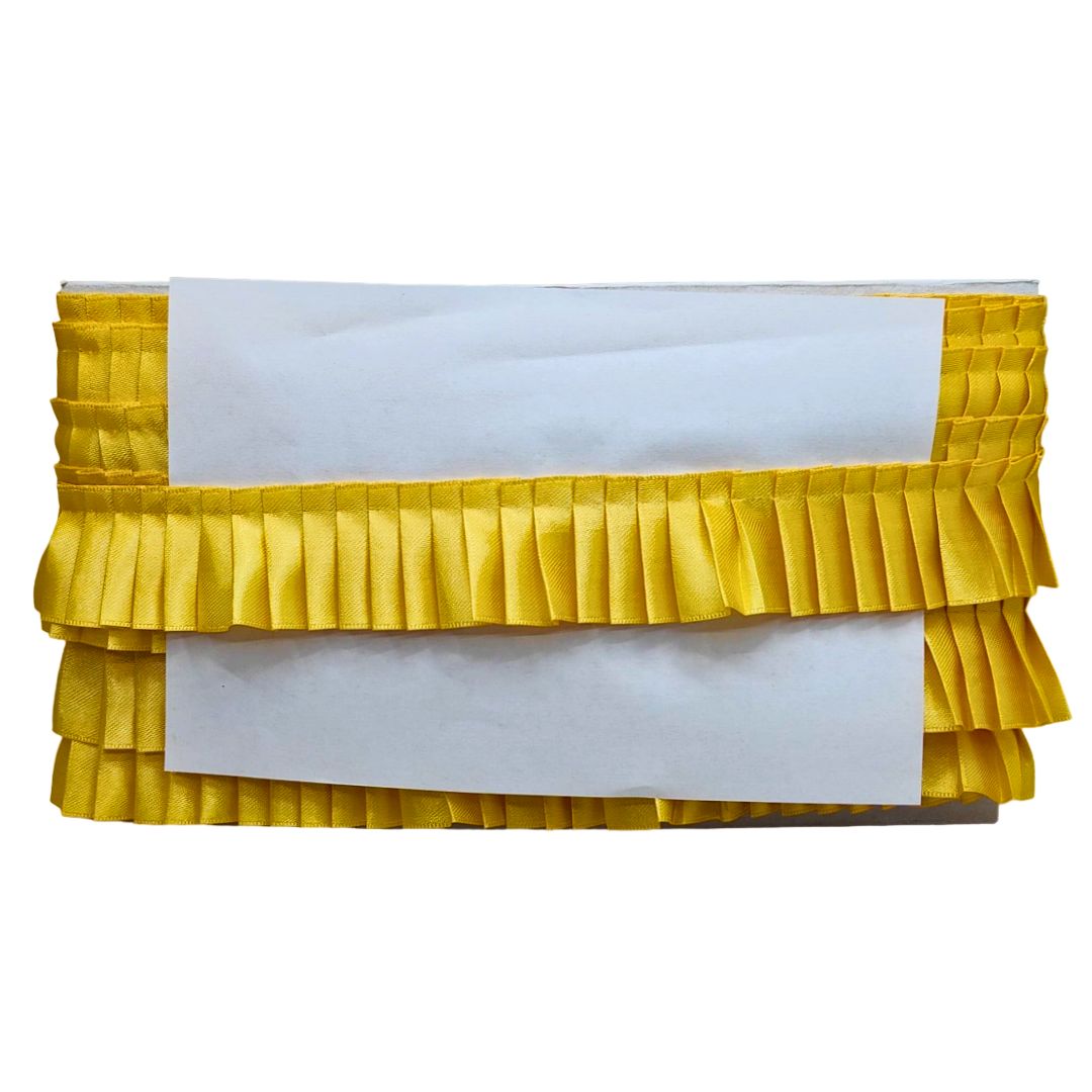 Yellow pleated clutch bag on a white background